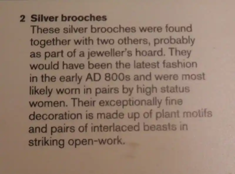 Cross and solar disc silver brooches